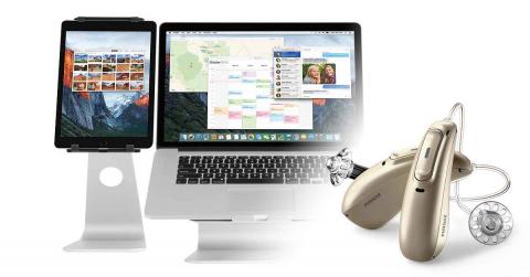 Hearing aids, a tablet and a laptop 