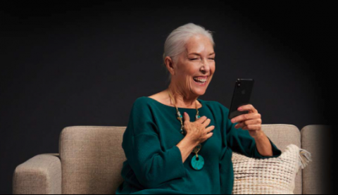 Woman speaking on an iPhone using two-way wireless streaming