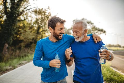 Man and his son walking together outdoors