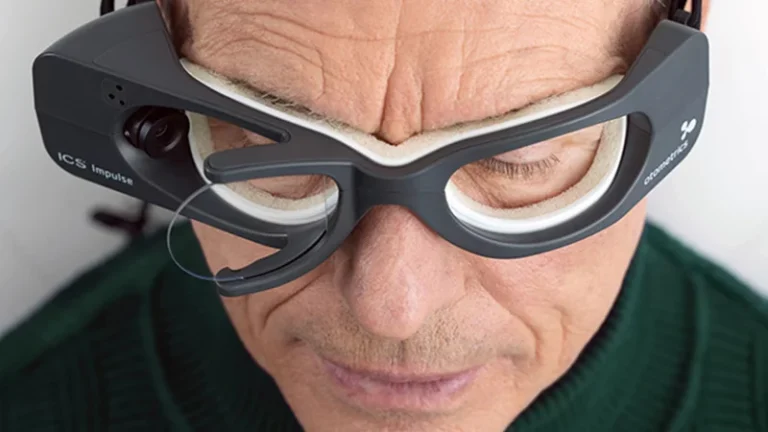 Man wearing Impulse goggles for a vestibular assessment to test his balance and dizziness.