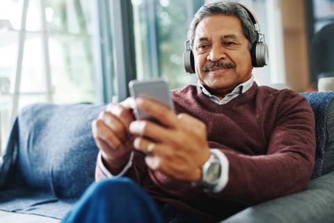 Man wearing headphones for Broadmead Hearing online hearing check Man wearing headphones for Broadmead Hearing online hearing check
